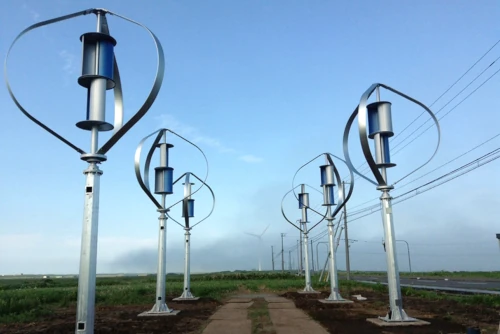 Éoliennes verticales modernes dans un champ.